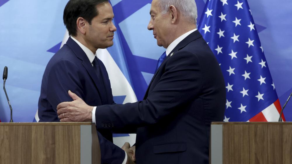 U.S. Secretary of State Marco Rubio, left, and Israeli Prime Minister Benjamin Netanyahu shake hands during a news conference at the Prime Minister&#039;s office in Jerusalem, Israel, Sunday, Feb. 16, 2025. (Evelyn Hockstein/Pool Photo via AP)