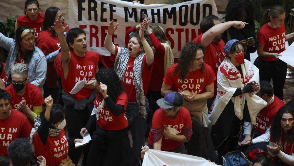 Demonstrators from the group, Jewish Voice for Peace, protest inside Trump Tower in support of Columbia graduate student Mahmoud Khalil, Thursday, March 13, 2025, in New York. (AP Photo/Yuki Iwamura)