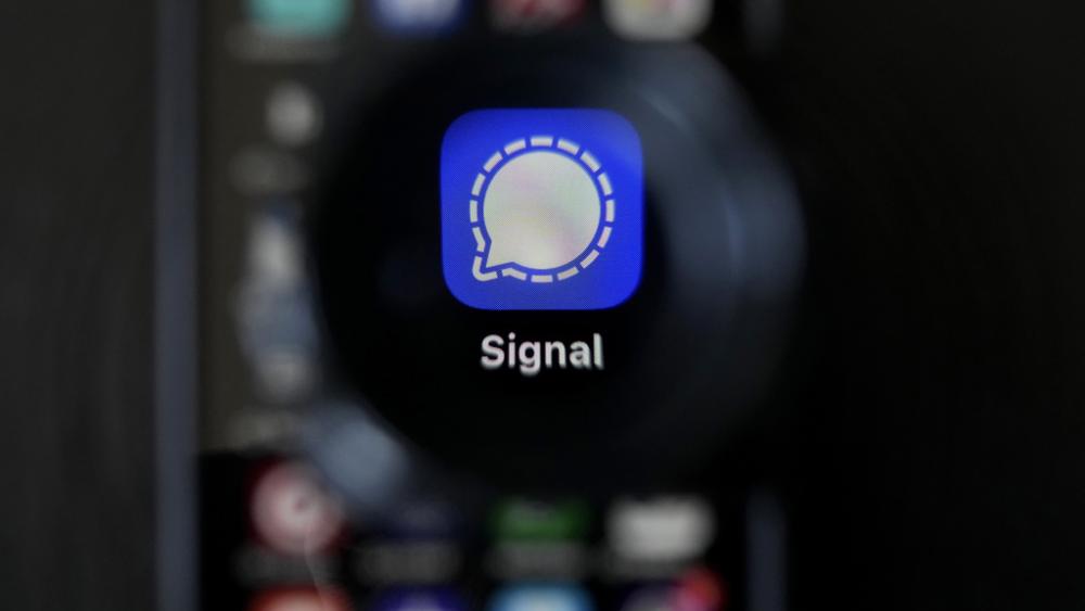 The Signal app is shown on a mobile phone. (AP Photo/Jeff Chiu)