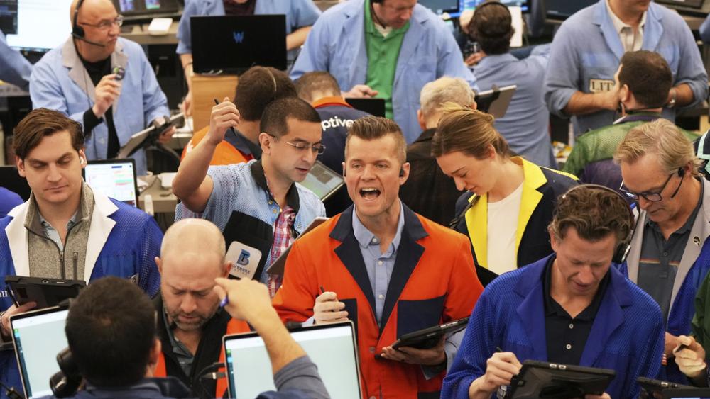 Traders work on the options trading floor at the Cboe Global Markets in Chicago, Tuesday, April 8, 2025. (AP Photo/Nam Y. Huh)
