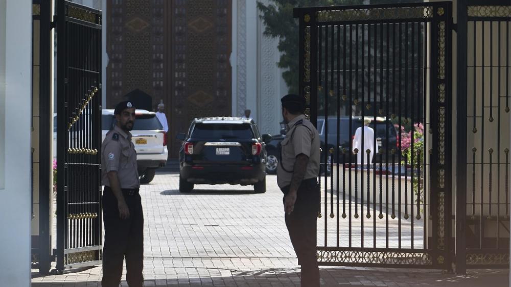 Omani security personnel watch a convoy believed to be carrying U.S. Mideast envoy Steve Witkoff in Muscat, Oman, Saturday, April 12, 2025. (AP Photo/Fatima Shbair)