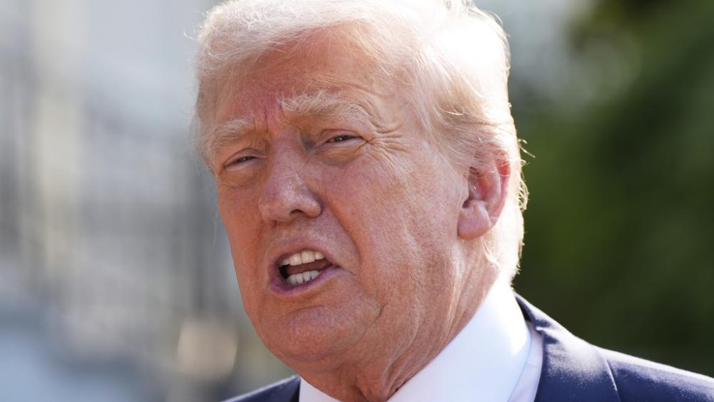 President Donald Trump speaks with reporters before departing on Marine One from the South Lawn of the White House, Friday, July 25, 2025, in Washington. The President is traveling to Scotland. (AP Photo/Alex Brandon)