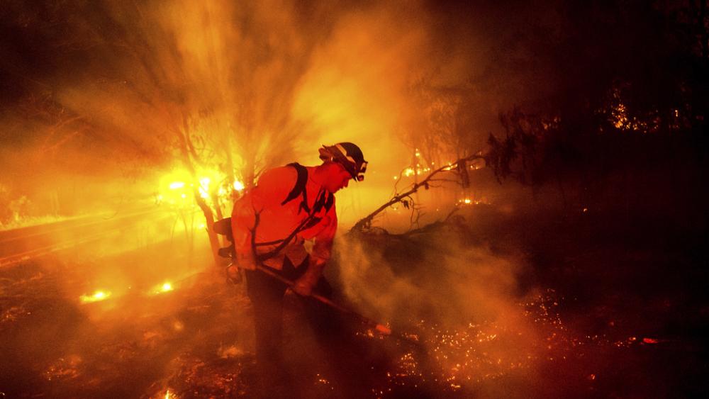 Firefighter Chris Fritz works to keep the Aero Fire from spreading through the Copperopolis community of Calaveras County, Calif., on Monday, June 17, 2024. (AP Photo/Noah Berger)
