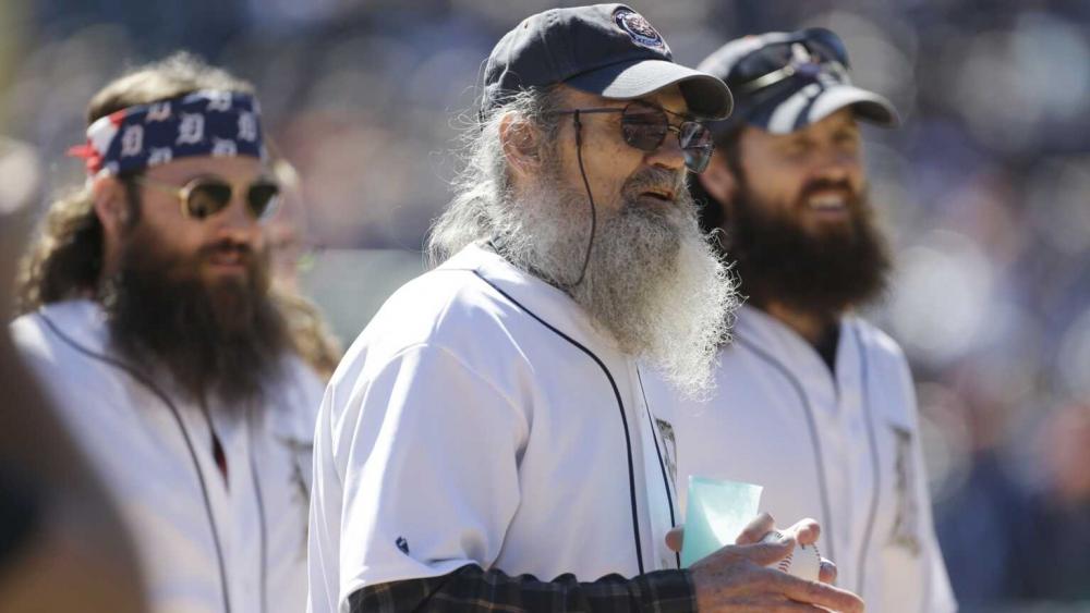 Willie, Si and Jase Robertson of &quot;Duck Dynasty&quot; are seen before throwing out the ceremonial first pitch in a baseball game, Sept. 22, 2013. (AP Photo/Carlos Osorio)