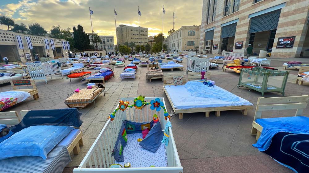 Over 230 empty beds on display to symbolize the babies, children, and elderly who were abducted from their homes by Hamas and taken to Gaza on October 7th. Photo Credit: CBN News.