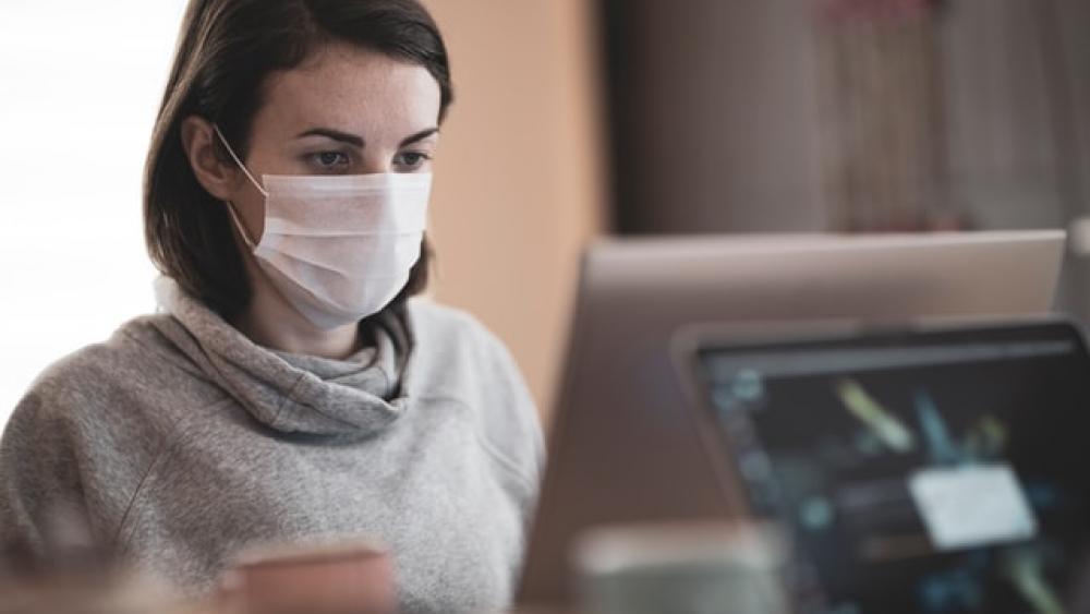 A woman working from her home during the coronavirus outbreak. Photo Credit: Engin Akyurt, Unsplash.