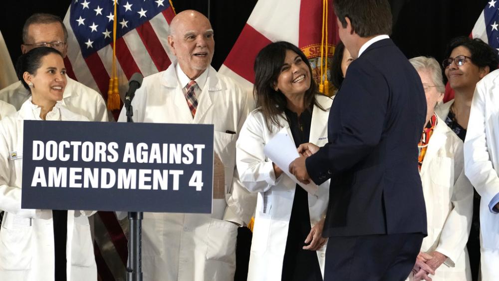 Florida Gov. Ron DeSantis joins doctors who oppose Amendment 4 - a pro-abortion ballot measure that would remove all abortion restrictions, Oct. 21, 2024, in Coral Gables, FL. (AP Photo/Lynne Sladky)