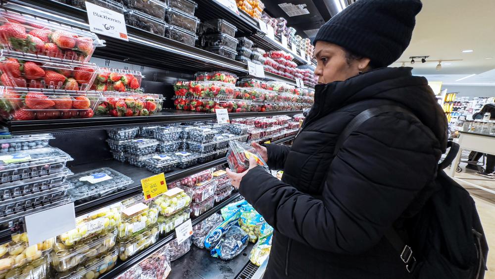 A woman browses fruits at a grocery store in New York. (AP Photo/Peter K. Afriyie)