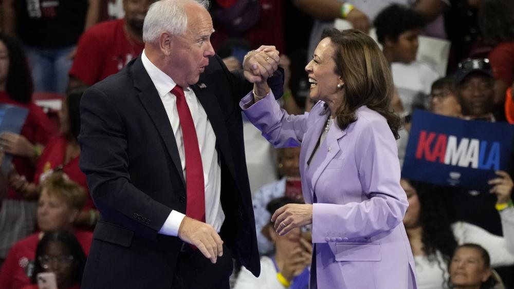 Democratic presidential nominee Vice President Kamala Harris and running mate Minnesota Gov. Tim Walz attend a campaign rally at the University of Nevada, Las Vegas on Aug. 10, 2024. (AP Photo/Jae Hong)