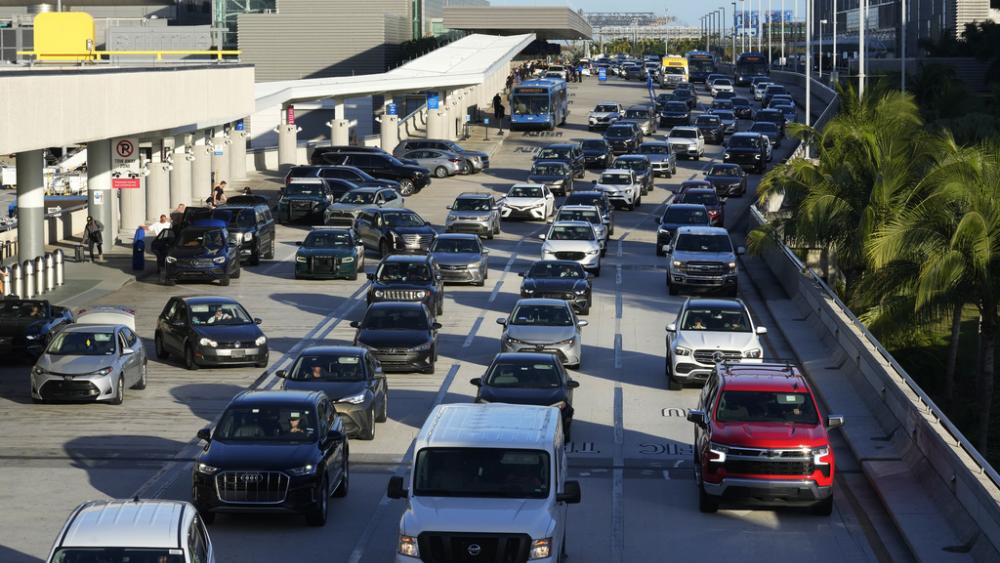 Cars line up to drop off passengers at Fort Lauderdale-Hollywood International Airport, Nov. 21, 2023, in Florida. (AP Photo/Marta Lavandier).
