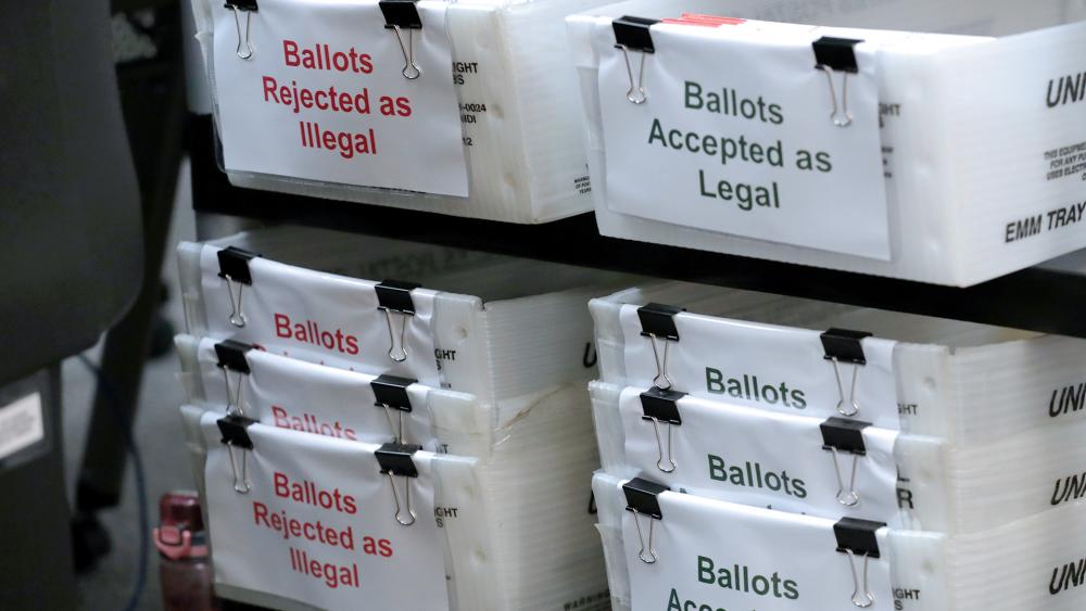 Boxes for illegal and legal vote-by-mail ballots as the Miami-Dade County canvassing board meets to verify signatures on vote-by-mail ballots for August 18 primary election on July 30 (AP Photo/Lynne Sladky)