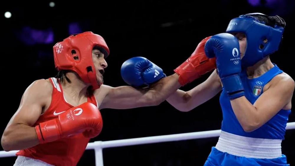 Algeria&#039;s Imane Khelif, left, fights Italy&#039;s Angela Carini in their women&#039;s 66kg preliminary boxing match at the 2024 Olympics, Aug. 1, 2024, in Paris. (AP Photo/John Locher)