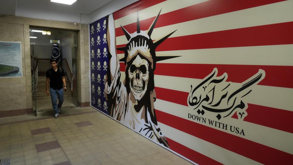 A man walks through the former U.S. Embassy, which has been turned into an anti-American museum in Tehran, Iran. (AP Photo/Vahid Salemi, File)