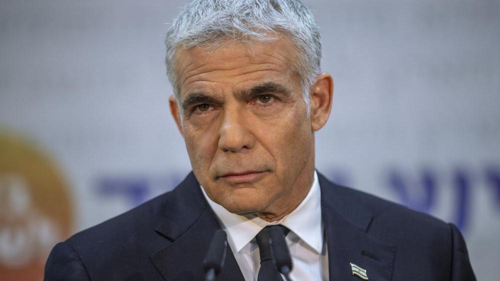 Israeli opposition leader Yair Lapid listens during a news conference in Tel Aviv, Israel. (AP Photo/Oded Balilty, File)