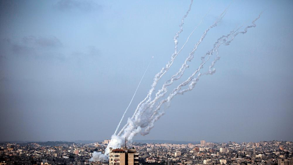 Terrorists launch rockets from the Gaza Strip towards Israel, Monday, May. 10, 2021. (AP Photo/Khalil Hamra)