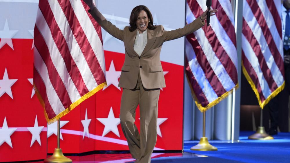 Democratic presidential nominee Vice President Kamala Harris raises her arms as she walks on stage during the Democratic National Convention, Aug. 19, 2024, in Chicago. (AP Photo/J. Scott Applewhite)