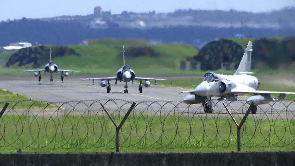 Taiwan Air Force Mirage fighter jets taxi on a runway at an airbase in Hsinchu, Taiwan, Friday, Aug. 5, 2022. (AP Photo/Johnson Lai)