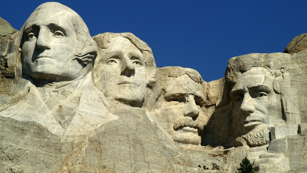 The Mt. Rushmore monument in South Dakota features George Washington, Thomas Jefferson, Abraham Lincoln, and Theodore Roosevelt.