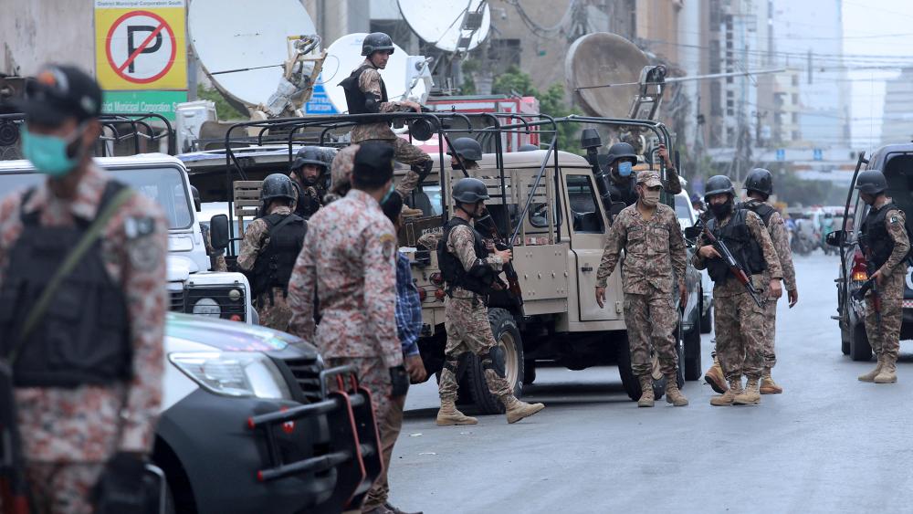 Security personnel surround the Stock Exchange Building after gunmen&#039;s attack in Karachi, Pakistan, Monday, June 29, 2020. Special police forces deployed to the scene of the attack and in a swift operation secured the building. (AP Photo/Fareed Khan)