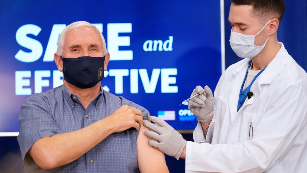 Vice President Mike Pence receives a Pfizer-BioNTech COVID-19 vaccine shot at the Eisenhower Executive Office Building on the White House complex, Dec. 18, 2020. (AP Photo/Andrew Harnik)