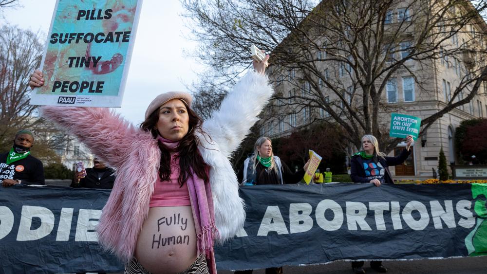 Melanie Salazar of the group Progressive Anti-Abortion Uprising protests the abortion pill outside the Supreme Court, March 26, 2024. (AP Photo/Amanda Andrade-Rhoades)