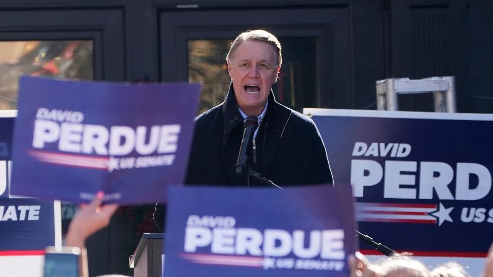 Sen. David Perdue, R-Ga., speaks during a campaign rally, Monday, Dec. 21, 2020, in Milton, Ga. (AP Photo/John Bazemore)