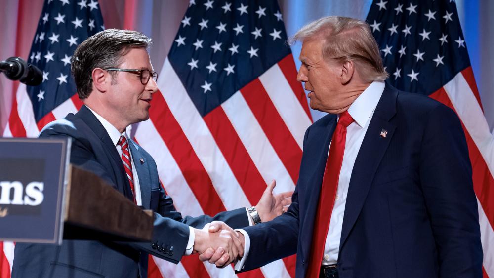 President-elect Donald Trump shakes hands with House Speaker Mike Johnson of La., as he arrives to speak at a meeting with the House GOP conference, Wednesday, Nov. 13, 2024, in Washington. (AP Photo/Alex Brandon)
