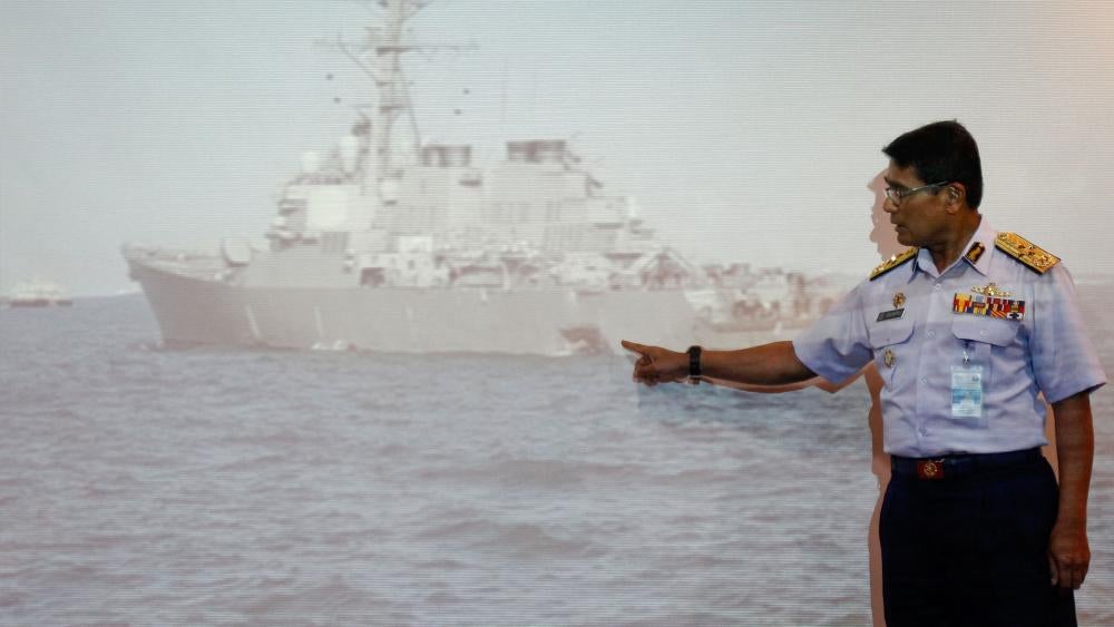 Malaysian Maritime Director Indera Abu Bakar points the damage of USS John S. McCain, Photo, AP, Daniel Chan