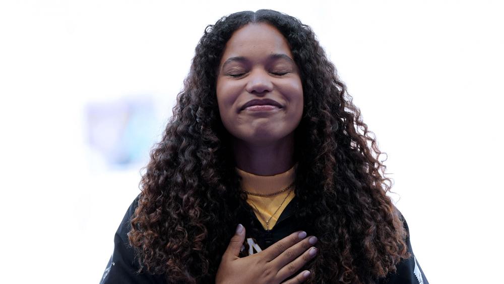 Women&#039;s shot put gold medalist Yemisi Ogunleye, of Germany, reacts on the podium at the 2024 Summer Olympics, Saturday, Aug. 10, 2024, in Paris. (AP Photo/Bernat Armangue)