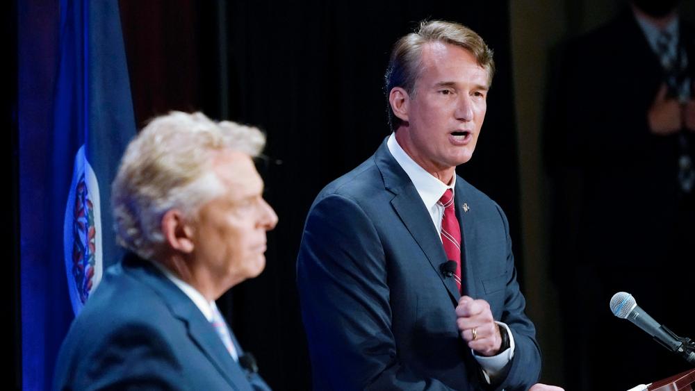 Republican Glenn Youngkin, right, debates Democratic candidate Terry McAuliffe in the Virginia governor&#039;s race (AP Photo/Steve Helber)