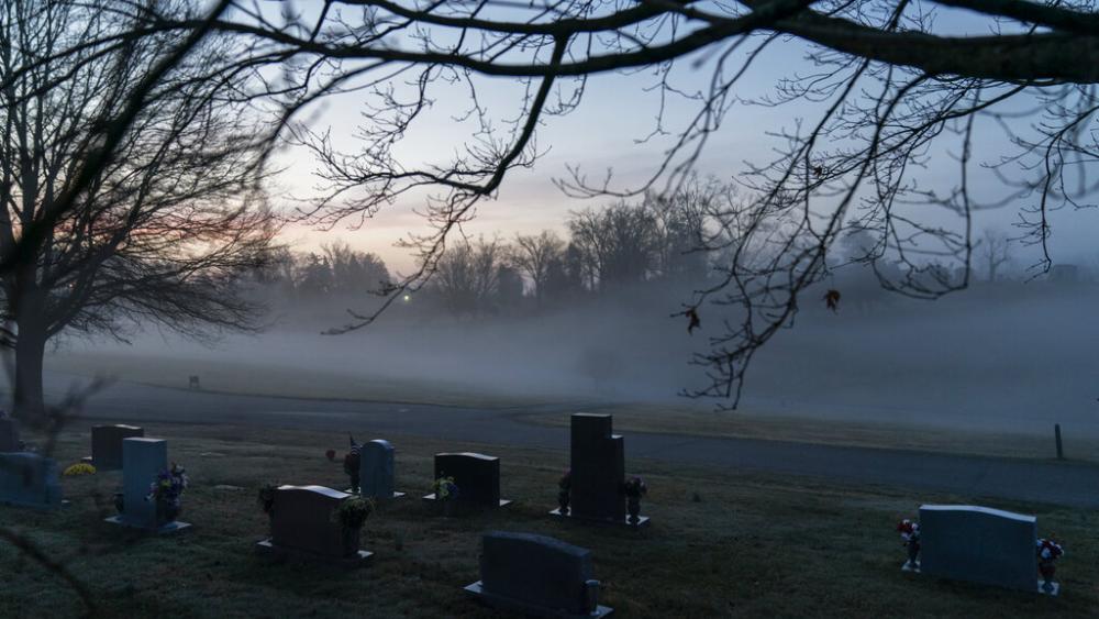 Morning fog blankets a cemetery in Huntington, W.Va., Wednesday, March 17, 2021. Huntington was once ground-zero for this opioid epidemic. (AP Photo/David Goldman)