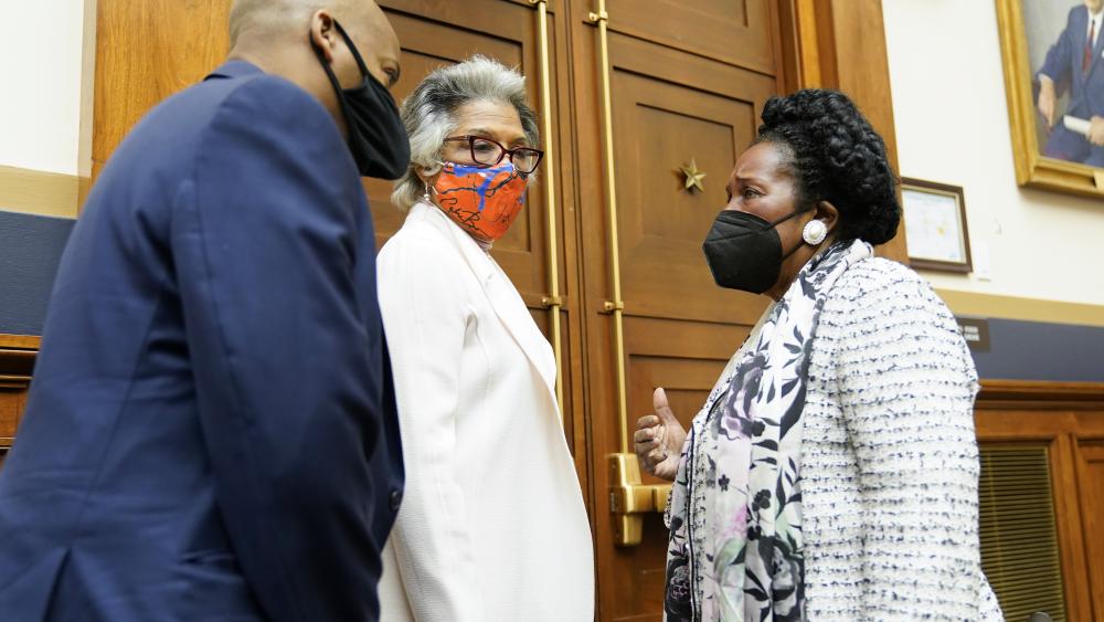 Rep. Joyce Beatty, D-Ohio, center, listens as Rep. Sheila Jackson Lee, D-Tex., right, chair of the Subcommittee on Crime, Terrorism, and Homeland Security, considers a bill about reparations. (AP Photo/J. Scott Applewhite)