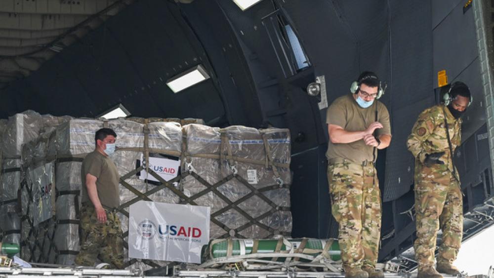 Relief supplies from the United States in the wake of India&#039;s COVID-19 situation arrive at the Indira Gandhi International Airport cargo terminal in New Delhi, India, Friday, April 30, 2021. (Prakash Singh/Pool via AP)