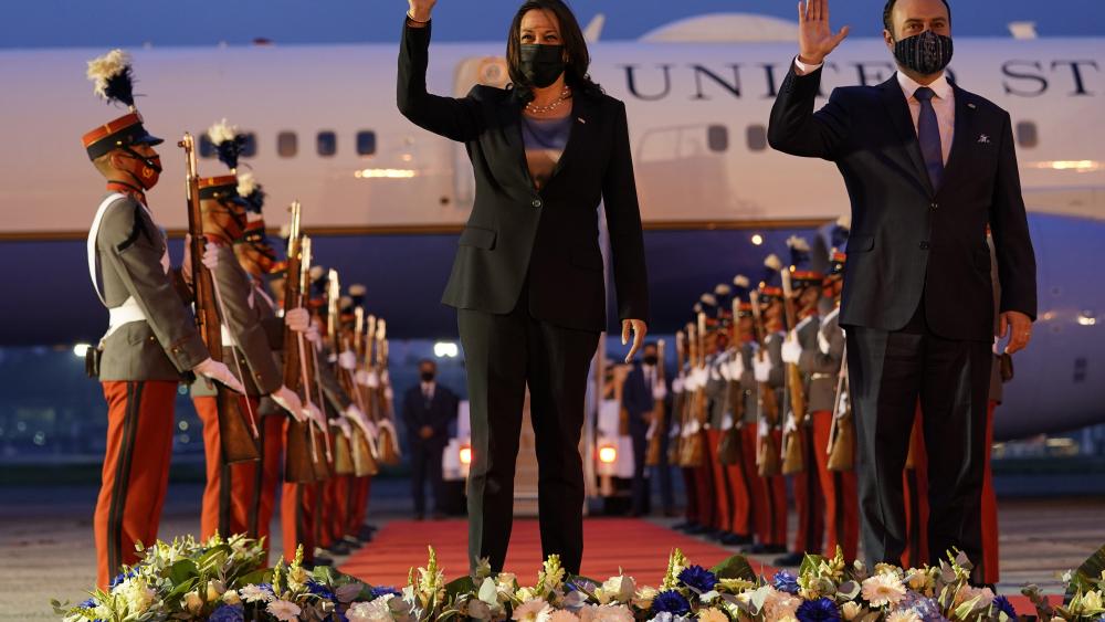 Vice President Kamala Harris and Guatemala&#039;s Minister of Foreign Affairs Pedro Brolo wave at her arrival cermony in Guatemala City, Sunday, June 6, 2021, at Guatemalan Air Force Central Command. (AP Photo/Jacquelyn Martin)