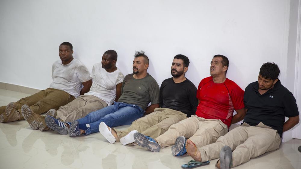Suspects in the assassination of Haiti&#039;s President Jovenel Moise, among them Haitian-American citizens James Solages, left, and Joseph Vincent, second left. (AP Photo/Joseph Odelyn)