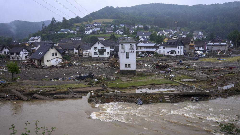 The river Ahr passes the village of Schuld, Germany, Friday, July 16, 2021 the day after the flood disaster. (Thomas Frey/dpa via AP)