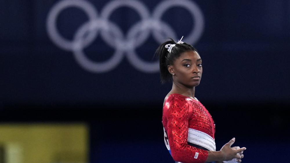 Simone Biles, of the United States, waits to perform on the vault during the artistic gymnastics women&#039;s final at the 2020 Summer Olympics, Tuesday, July 27, 2021, in Tokyo. (AP Photo/Gregory Bull)