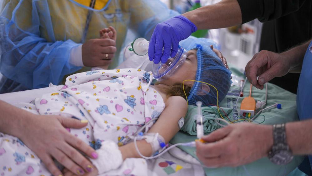 Karina Andreiko, a 5-year-old Ukrainian girl, is prepped for heart surgery by a team led by Dr. Sagi Assa, head of invasive pediatric cardiology. (AP Photo)