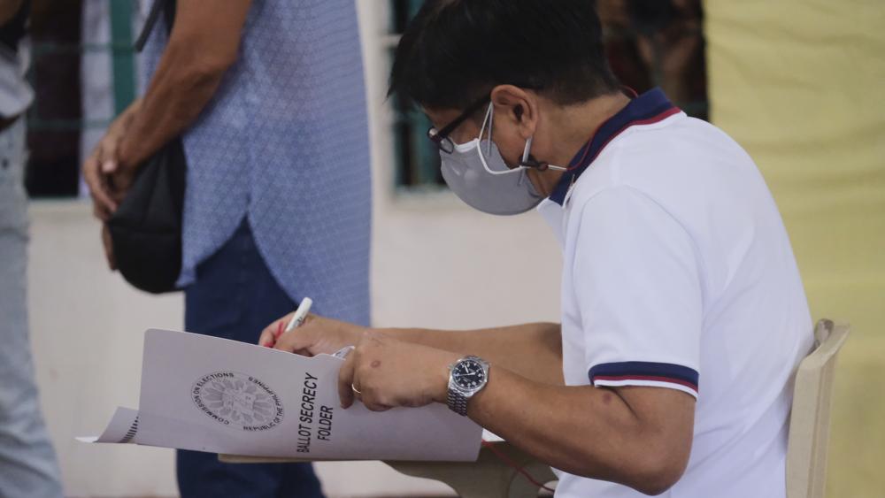 Presidential candidate Ferdinand Marcos Jr., the son of the late dictator, votes at a polling center in Batac City, Ilocos Norte, northern Philippines on Monday, May 9, 2022. (AP Photo)