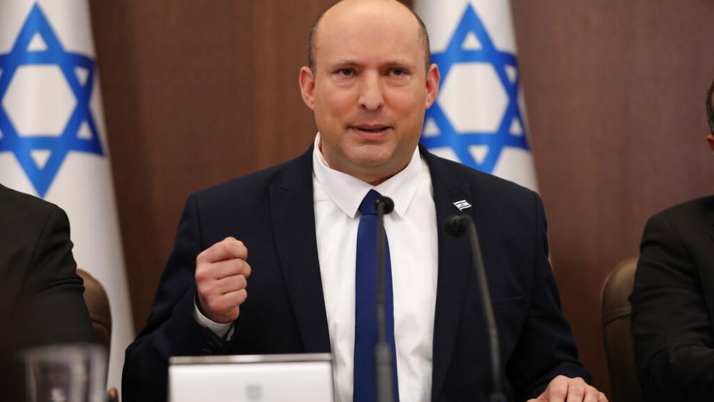 Israeli Prime Minister Naftali Bennett, center, attends a cabinet meeting at the prime minister&#039;s office in Jerusalem, Sunday, May 15, 2022. (Abir Sultan/Pool Photo via AP)