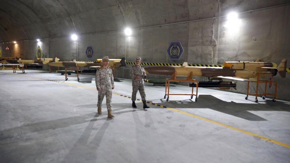 In this photo released on Saturday, May 28, 2022 by website of the Iranian Army, Iranian officials visit n underground drone base tunnel of the Army in the heart of the country&#039;s western Zagros Mountains. (Iranian Army via AP)