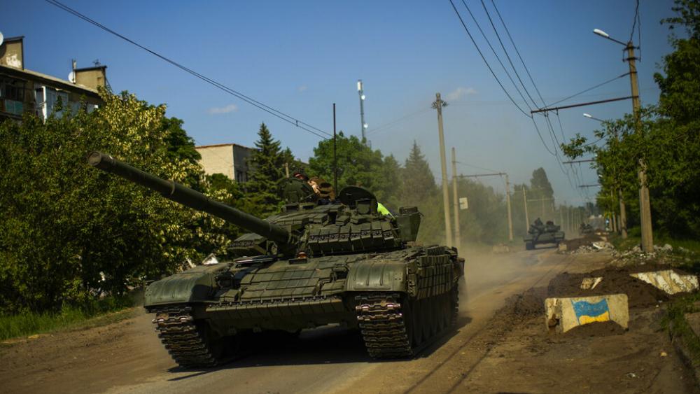 Ukrainian tanks move in Donetsk region, eastern Ukraine, Monday, May 30, 2022. (AP Photo/Francisco Seco, file)