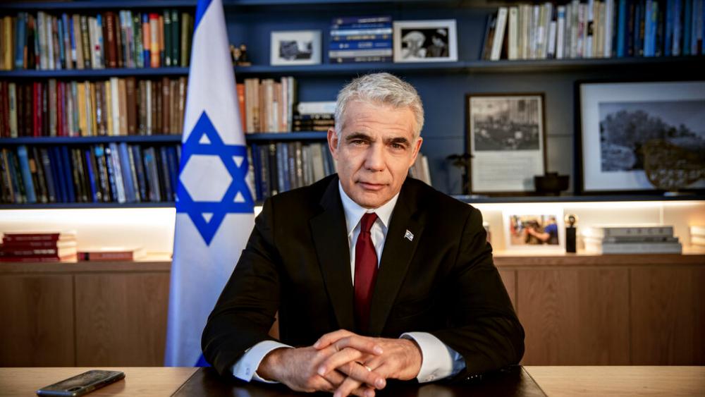 Yair Lapid poses for a photo at his office in Tel Aviv, Israel, Thursday, May 21, 2020. (AP Photo/Oded Balilty, File)