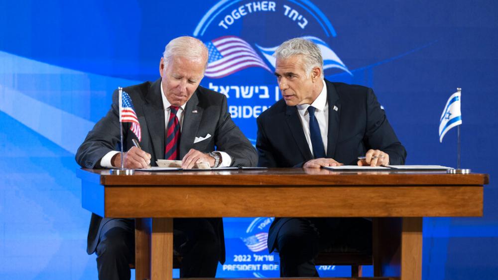 U.S. President Joe Biden and Israeli Prime Minister Yair Lapid sign a joint declaration affirming the &quot;unbreakable bonds&quot; between the two countries and a U.S. commitment to protecting Israeli security, in Jerusalem, Thursday, July 14, 2022. AP Photo