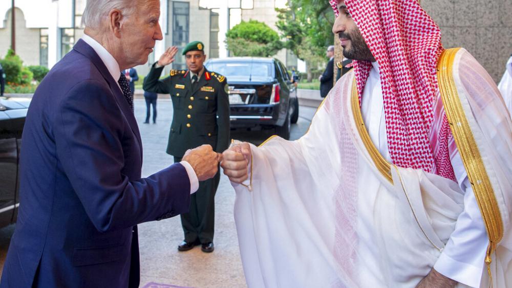 In this image released by the Saudi Royal Palace, Saudi Crown Prince Mohammed bin Salman, right, greets President Joe Biden with a fist bump. (Bandar Aljaloud/Saudi Royal Palace via AP)
