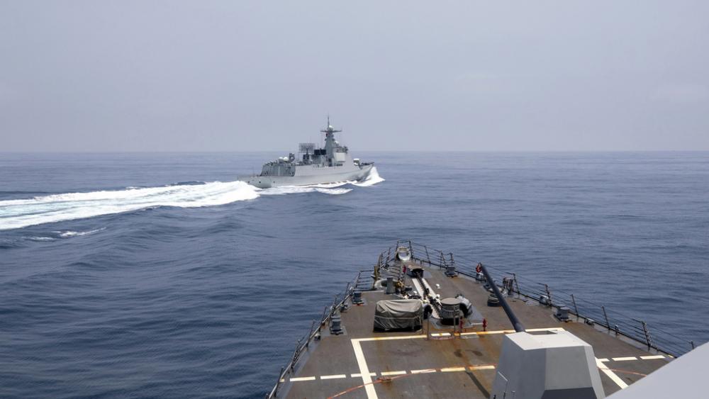 A Chinese navy ship cuts sharply across the path of the American destroyer USS Chung-Hoon, forcing the U.S. ship to slow to avoid a collision. (Photo: Mass Communication Specialist 1st Class Andre T. Richard/U.S. Navy via AP)
