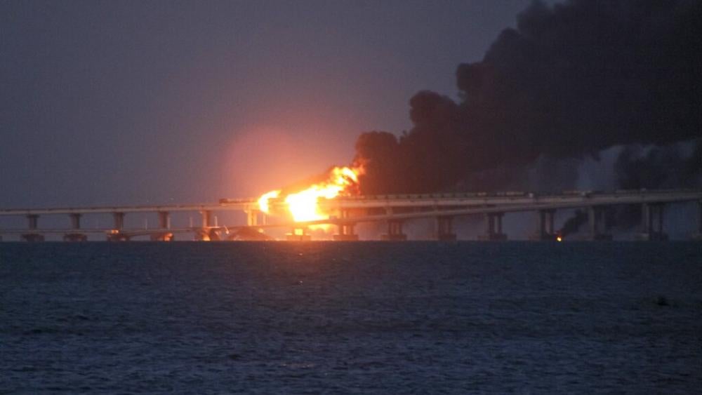 Flames and smoke rise from the Crimean Bridge over the Kerch Strait in Crimea, Saturday, Oct. 8, 2022. The bridge is a key supply artery for Moscow&#039;s faltering war effort in southern Ukraine. (AP Photo)