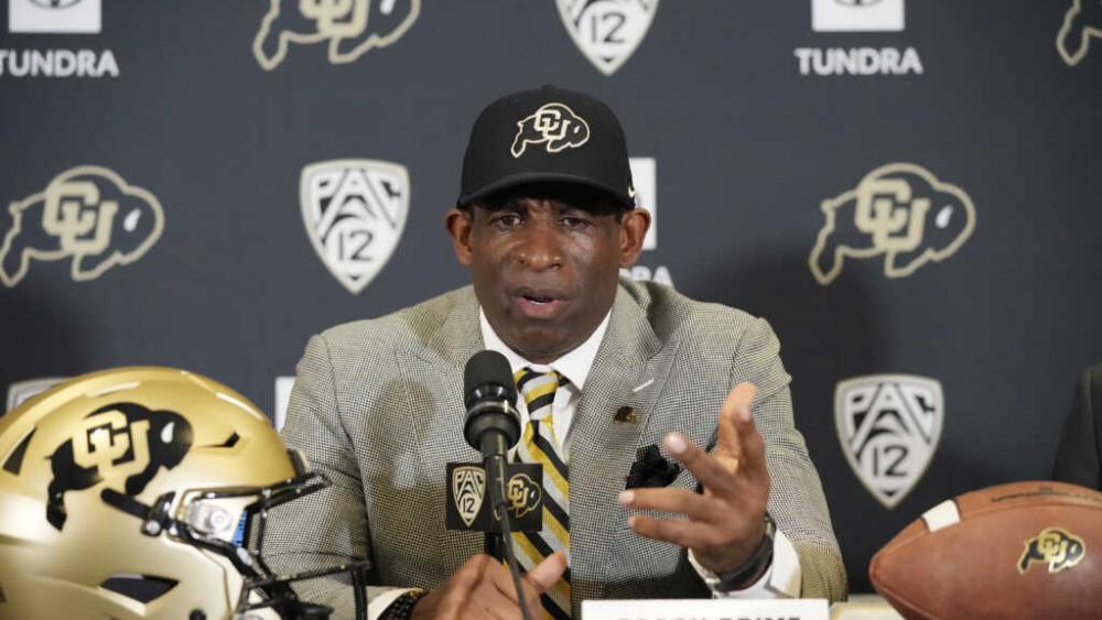 Deion Sanders speaks after being introduced as the new head football coach at the University of Colorado during a news conference Sunday, Dec. 4, 2022, in Boulder, CO (AP Photo/David Zalubowski)