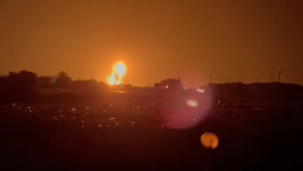 Wide of explosion lighting up the night sky as Israel strikes Hamas targets in Gaza. 13 September 2021. Screesnshot of AP footage.