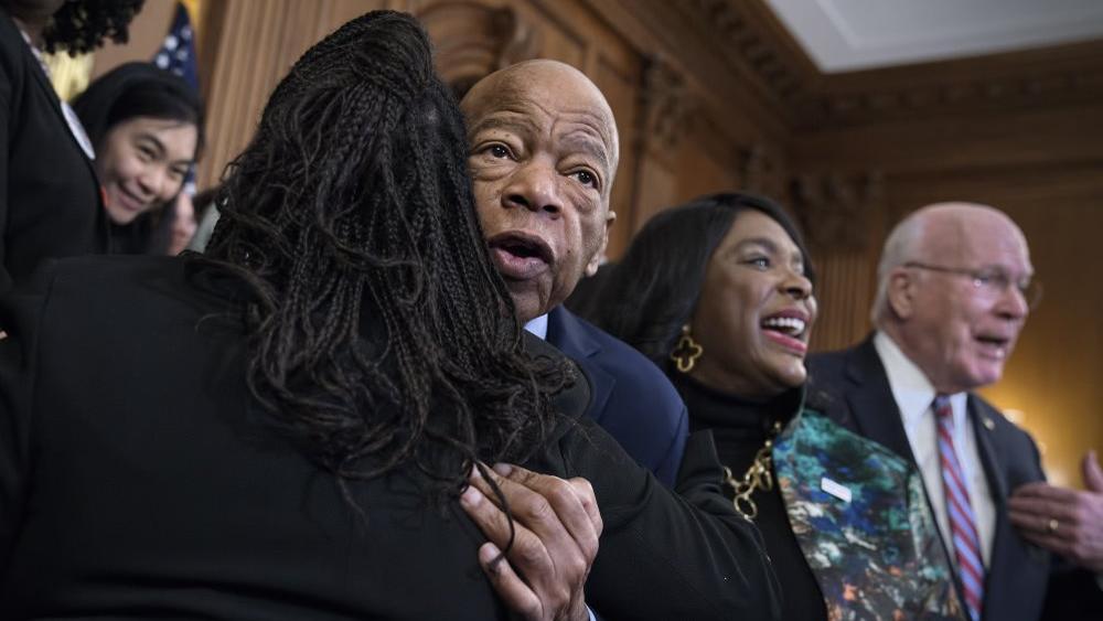 Civil rights leader Rep. John Lewis, D-Ga., is hugged as House Democrats gathered before passing the Voting Rights Advancement Act on Friday, Dec. 6, 2019. (AP Photo)